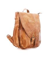 The Bed Stu Ranger is a sturdy tan leather backpack with a front flap, buckle closure, front pocket, and top handle—perfect for everyday wear and shown against a white background.