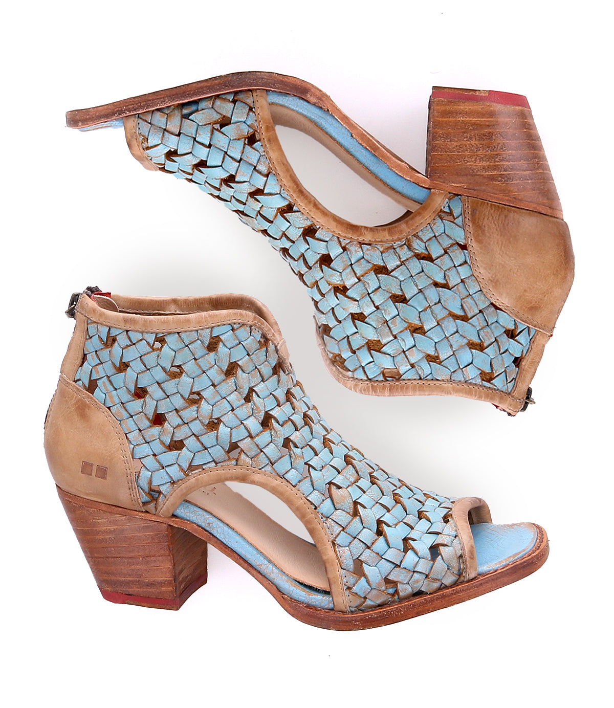 A pair of blue woven women's handmade peep-toe heels by Bed Stu on a white background.