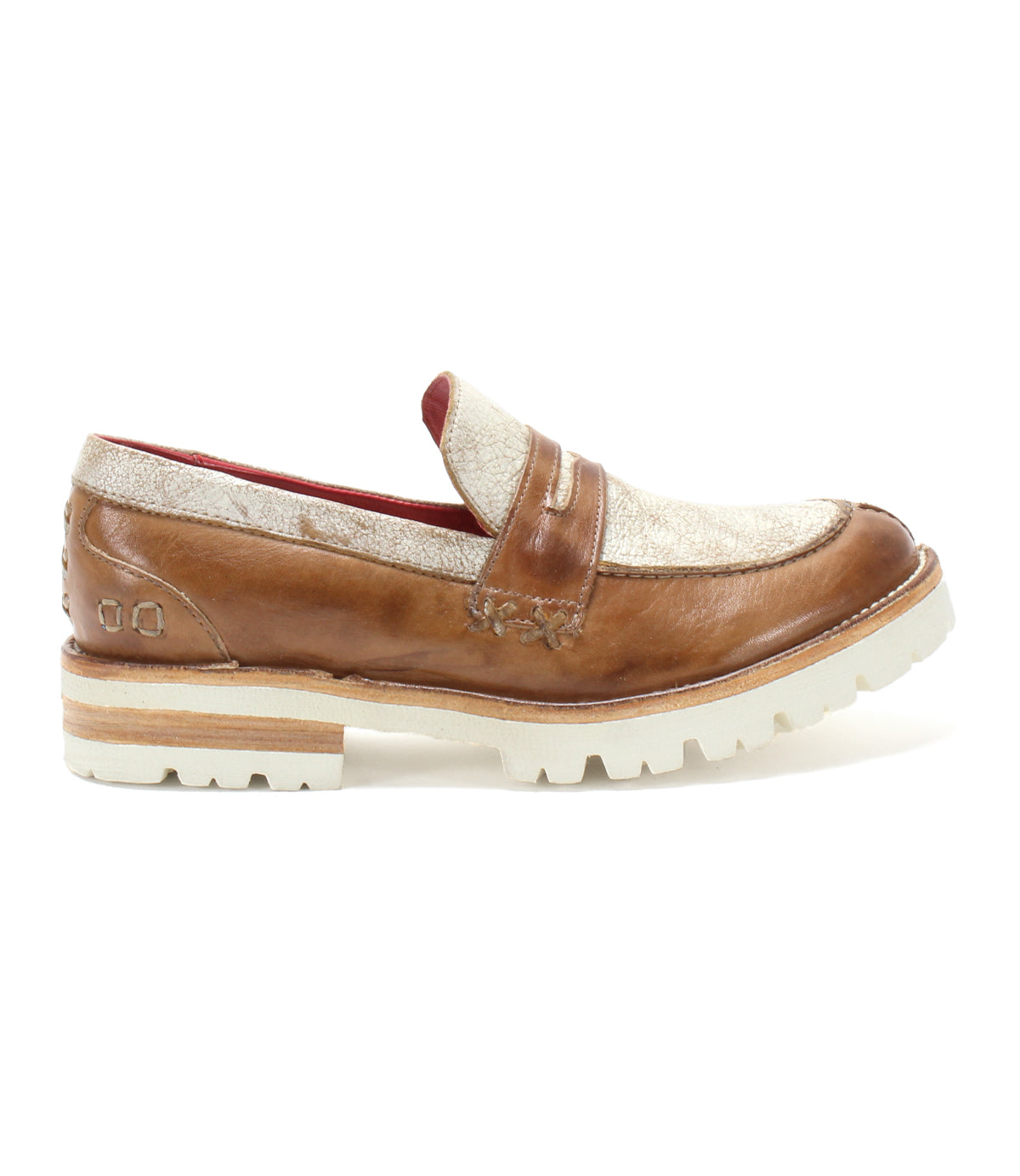 The Bed Stu Reina III is a leather penny loafer for men, featuring tan and white soles and providing all-day comfort.