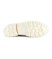 The Bed Stu Reina III leather penny loafer offers all-day comfort with its white soles, perfectly standing out against the white background.