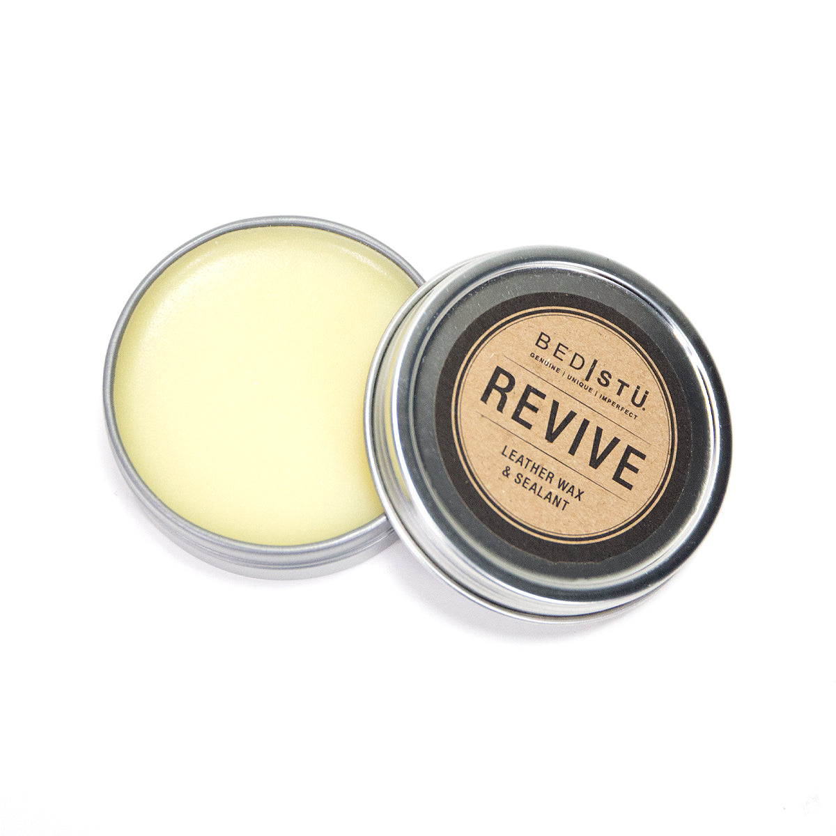 An open tin of Bed Stu revive leather wax and sealant, a protective barrier for leather products, on a white background.