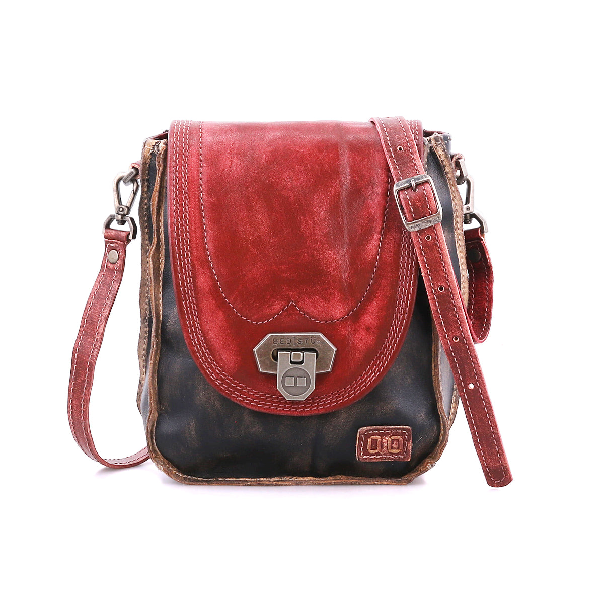 The Bed Stu Rhyme is a compact crossbody with a distressed black body, red flap, brown strap, and metal clasp—an ideal handbag for versatile day-to-night use.