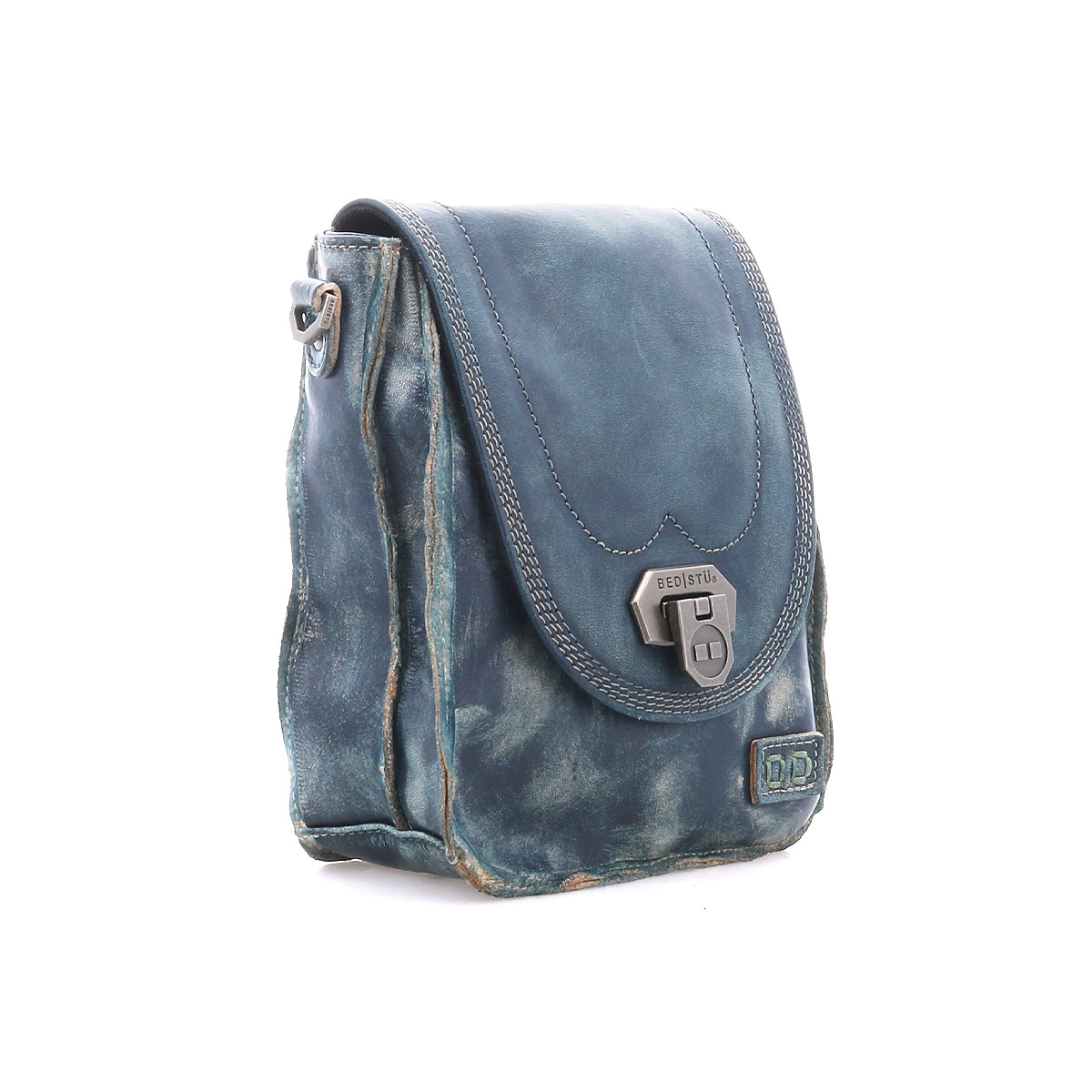 The Bed Stu Rhyme is a blue leather crossbody bag featuring a front flap with metal clasp, visible stitching, and slightly distressed edges—an effortlessly stylish, hands-free accessory for everyday wear.