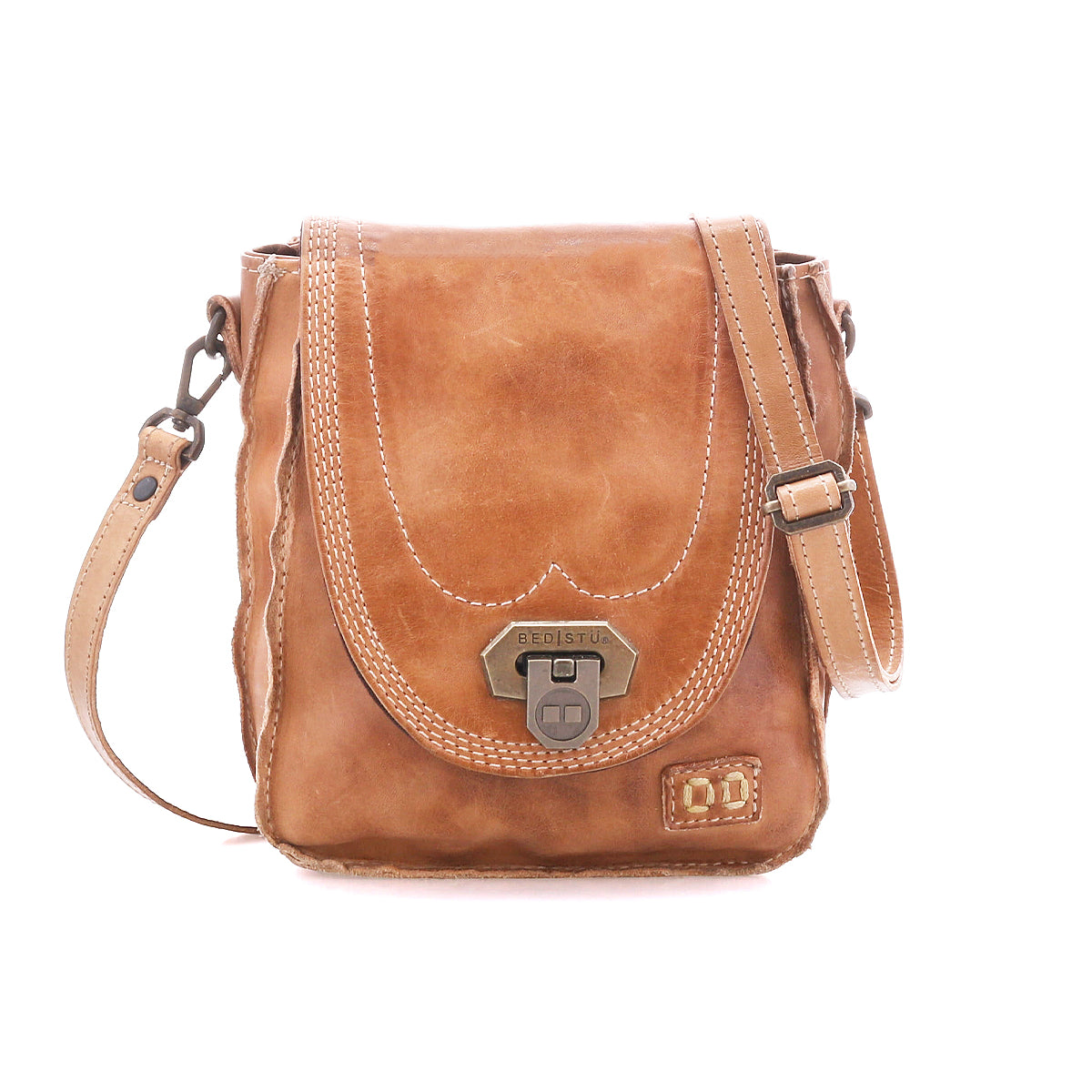 Bed|Stü Rhyme tan leather crossbody bag featuring a flap closure, antique brass hardware, and contrast stitching on this compact handbag.