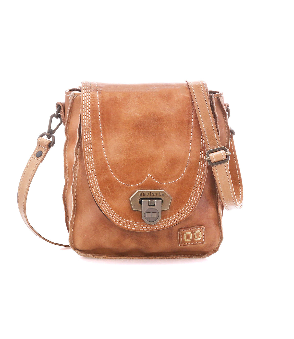 Bed|Stü Rhyme tan leather crossbody bag featuring a flap closure, antique brass hardware, and contrast stitching on this compact handbag.