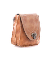 Bed|Stü Rhyme tan leather compact crossbody bag with a fold-over flap, metallic locking clasp, and stitched detailing.