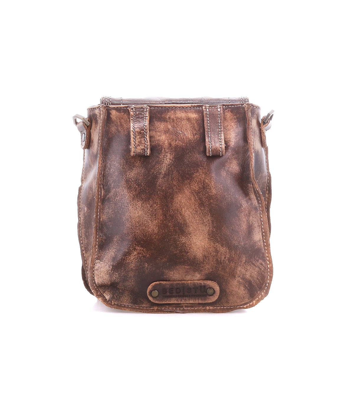 The Bed Stu Rhyme is a compact crossbody in distressed brown leather with visible stitching and a metal logo plate on the front, creating a versatile handbag for everyday use.