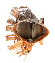 The Bed Stu Rimes is a handcrafted leather tote with stylish fringe detail, an open top for easy access, a spacious interior, and comfortable shoulder straps.