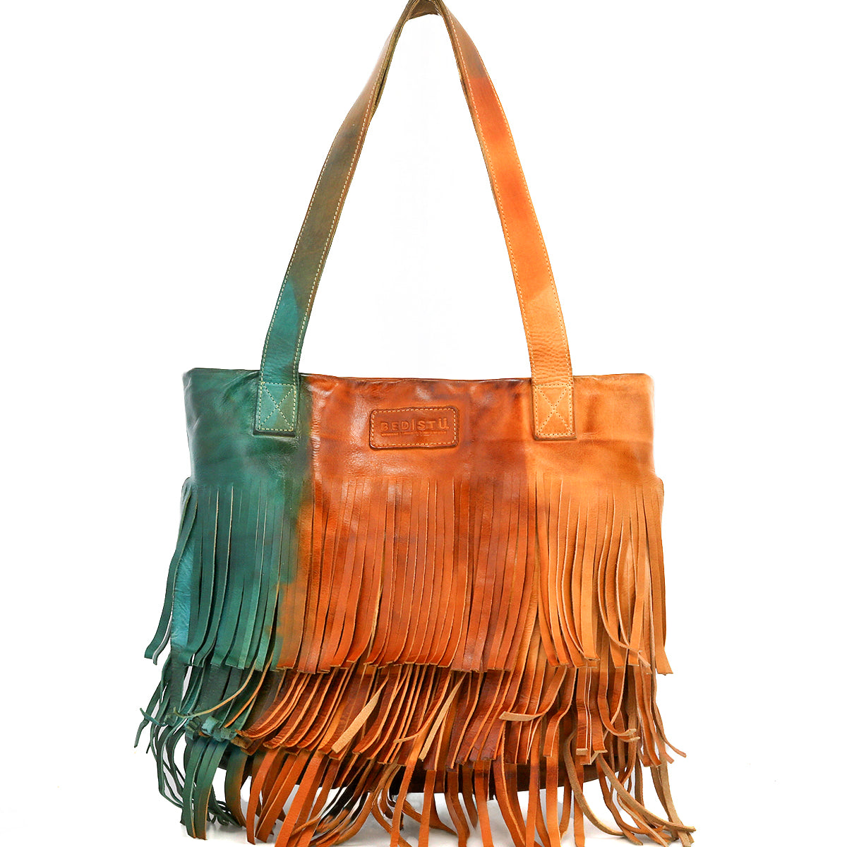 The Bed Stu Rimes is a brown and green handcrafted leather tote featuring long fringe, dual shoulder straps, a front rectangular stitched label, and a spacious interior for your essentials.