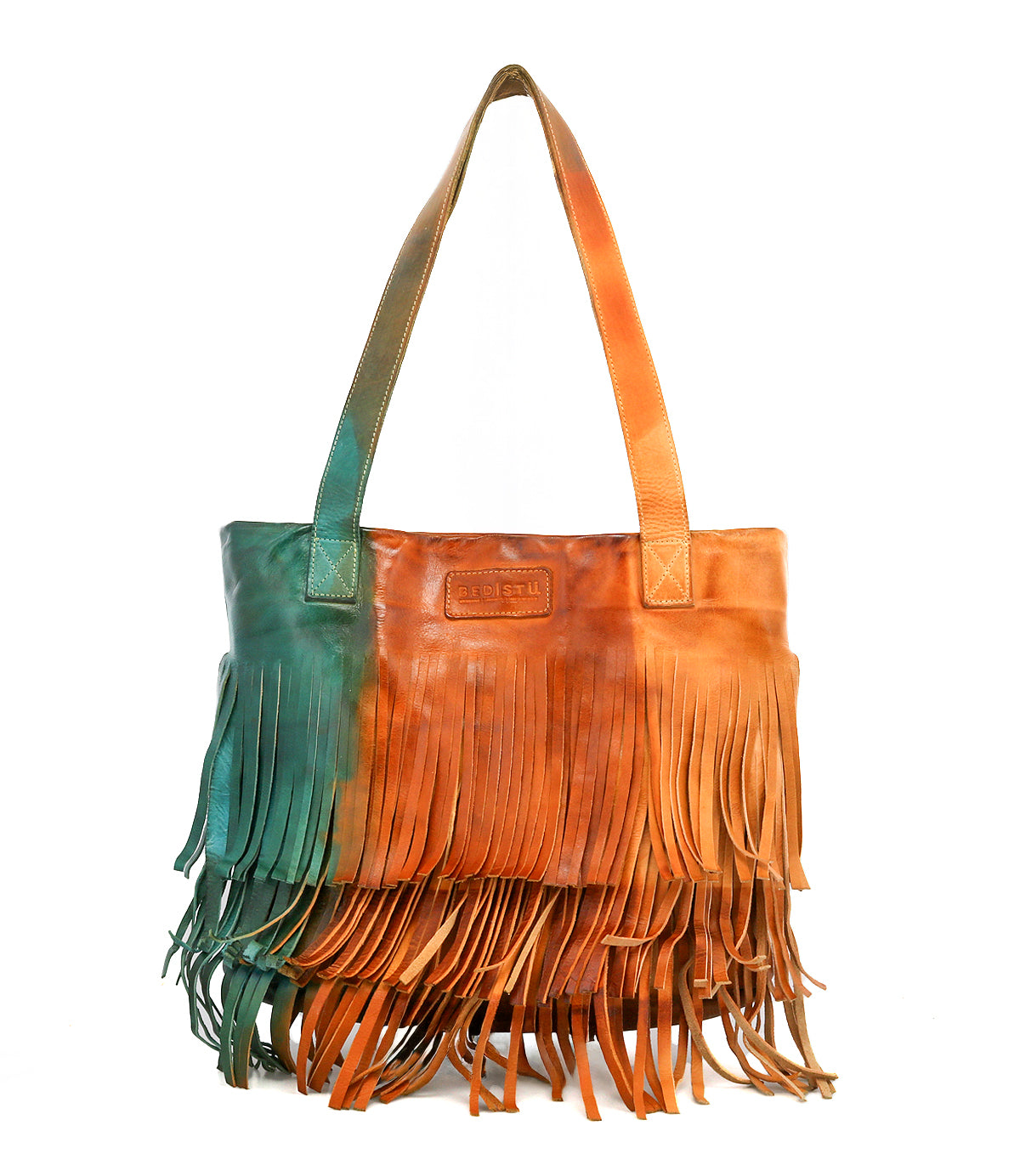 The Bed Stu Rimes is a brown and green handcrafted leather tote featuring long fringe, dual shoulder straps, a front rectangular stitched label, and a spacious interior for your essentials.