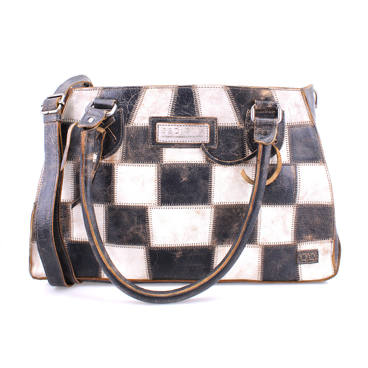 A sustainable, checkered Rockababy SL handbag with brown leather trim and handles on a white background by Bed Stu.