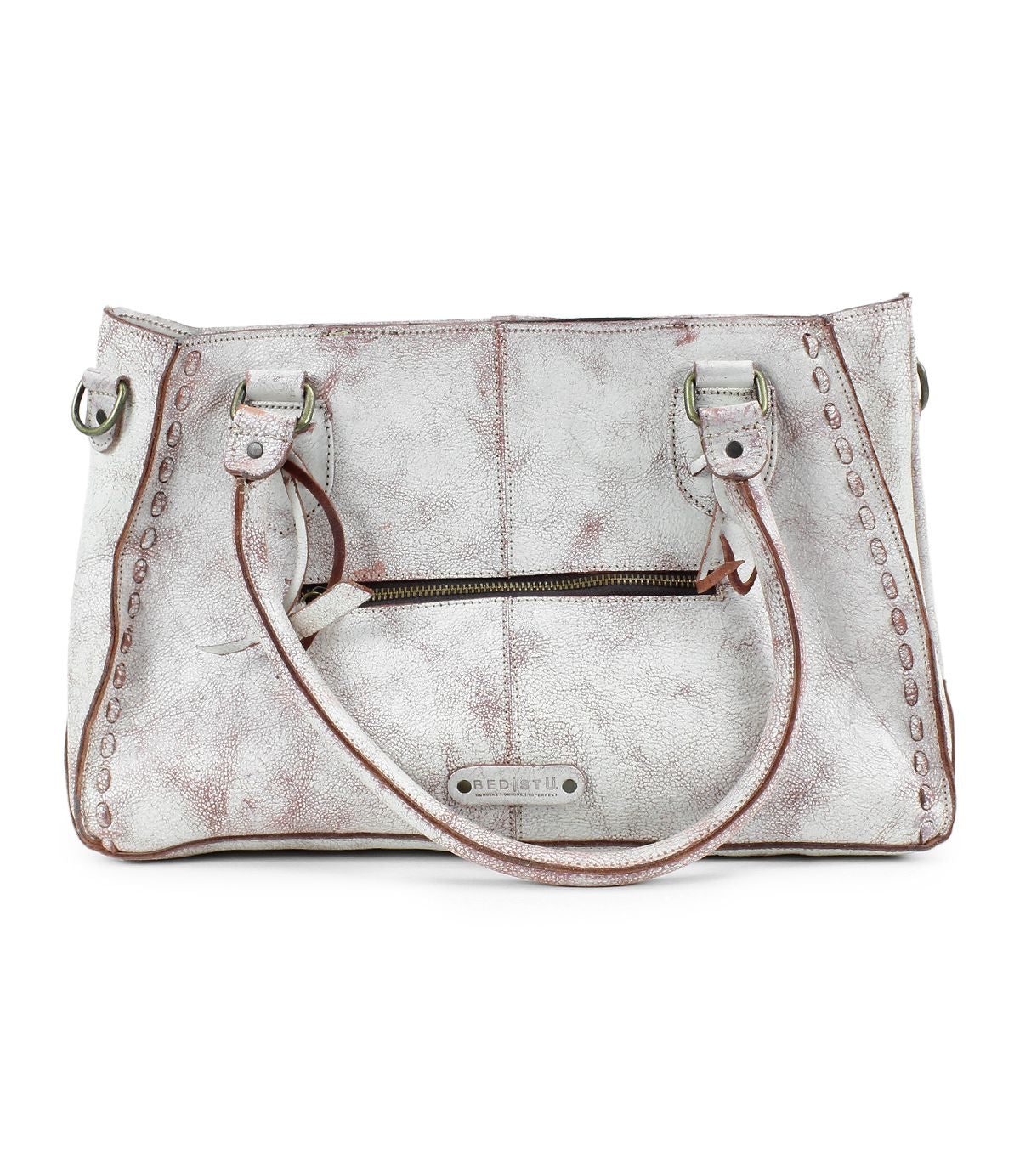 The Bed Stu Rockababy is a distressed leather handbag in white and brown, featuring dual handles, a front zipper pocket, and padded shoulder straps for added comfort.