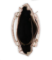 Open Bed Stu Rockababy handbag, brown and white with visible zippers and handles, stylishly compact against a white background. The empty interior is ready for essentials, ensuring fashionable convenience on the go.