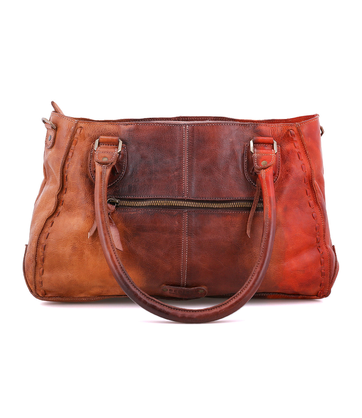 The Rockababy handbag by Bed|Stü, crafted from brown vegetable-tanned leather, features two handles, a front zipper pocket, and visible stitching along the edges. It is displayed against a white background.