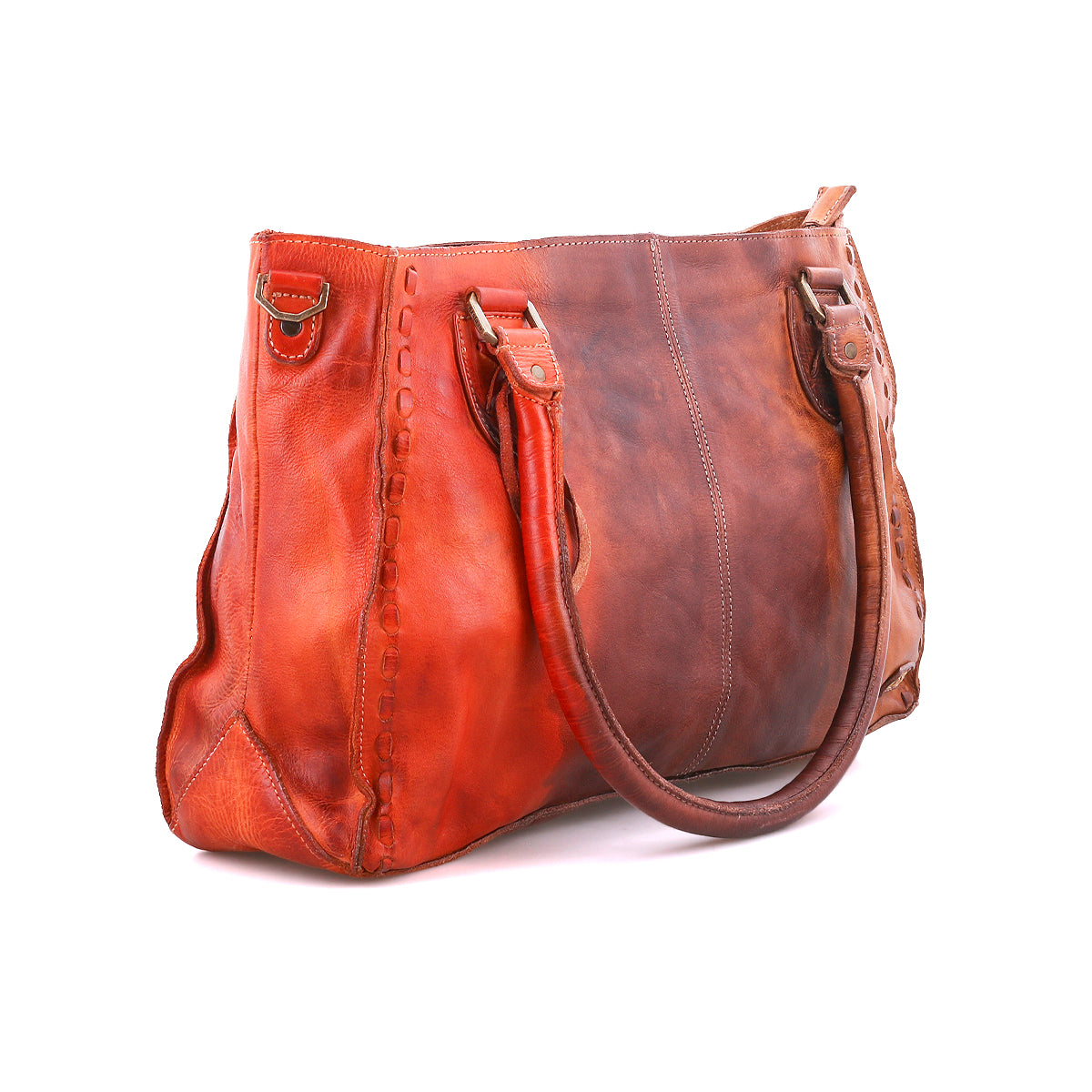 The Rockababy by Bed|Stü is a compact brown and orange leather bag featuring two handles, visible stitching, and metal hardware. Crafted from premium vegetable-tanned leather, it is showcased against a white background.