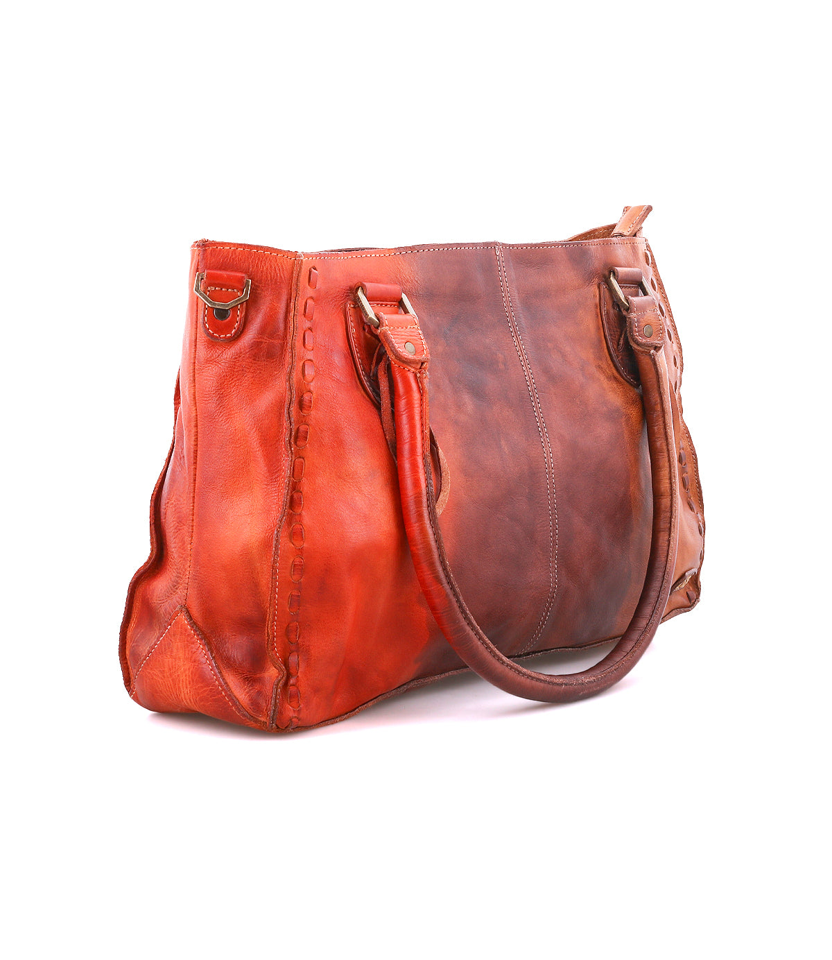 The Rockababy by Bed|Stü is a compact brown and orange leather bag featuring two handles, visible stitching, and metal hardware. Crafted from premium vegetable-tanned leather, it is showcased against a white background.