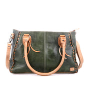 The Bed Stu Rockababy is a rectangular dark green leather everyday bag with tan handles, detailed stitching, and a detachable crossbody strap, shown on a white background.