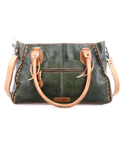 A green leather Bed Stu Rockababy handbag with tan handles, tan stitching, a front zipper pocket, and a crossbody strap—ideal for everyday use. The "Bed Stu" brand appears on a leather patch at the bottom center.