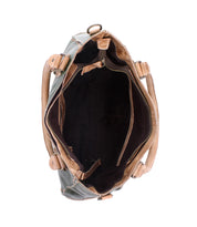 Top view of the Bed Stu Rockababy bag shows its roomy interior, zippered pocket, side compartments, light brown handles, and a convenient crossbody strap.