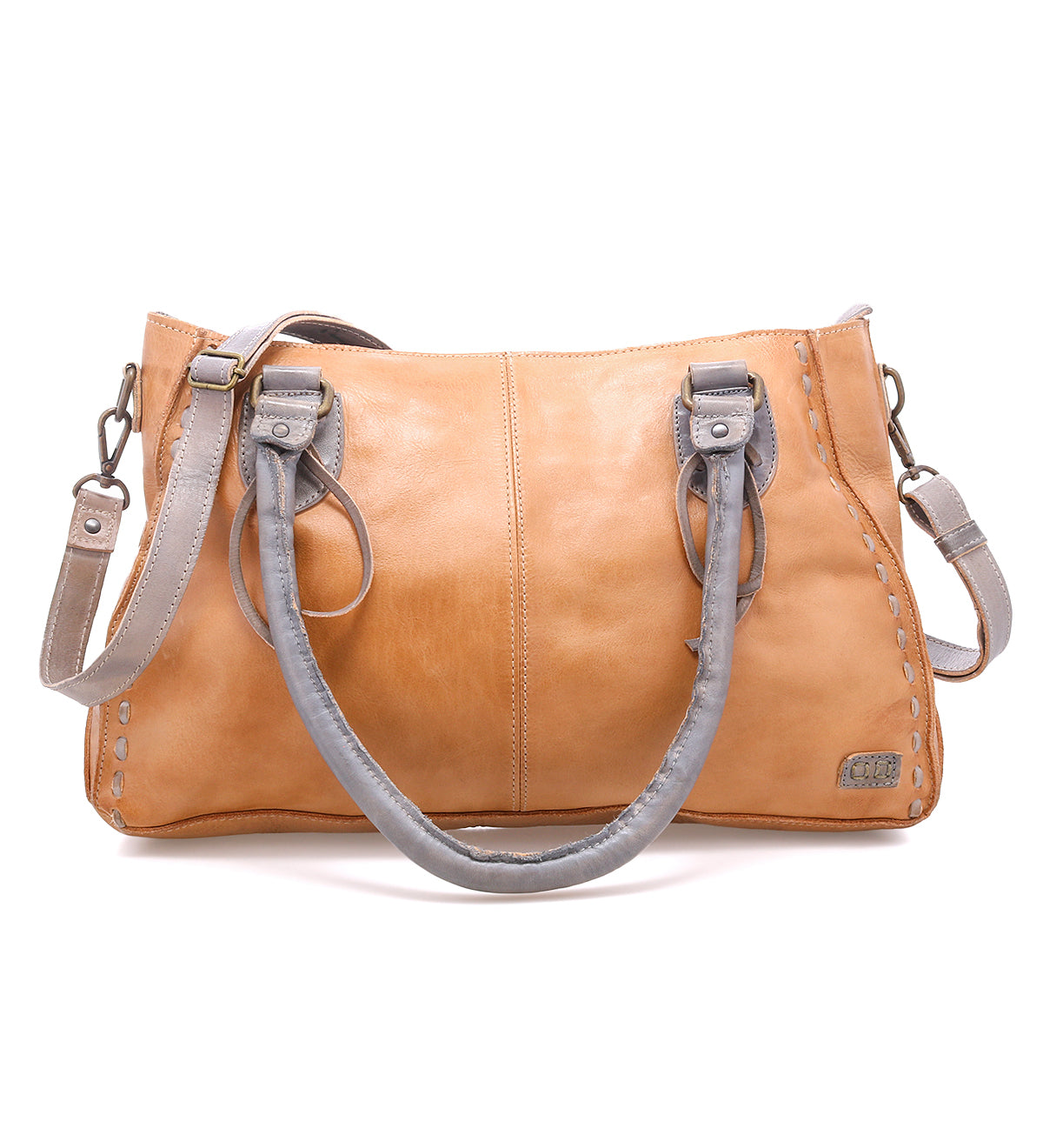 The Bed Stu Rockababy is a tan leather handbag with two gray handles and a detachable gray crossbody strap, ideal as a compact everyday bag, shown against a white background.