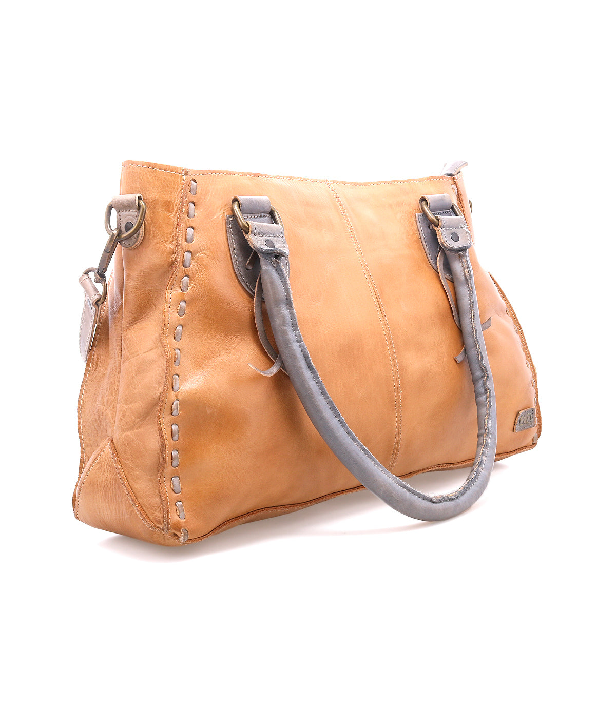 The Bed Stu Rockababy is a tan leather handbag with gray handles, decorative stitching, and a detachable crossbody strap—an ideal compact everyday bag, shown on a white background.