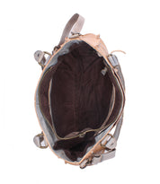 Top view of the Bed Stu Rockababy, a compact everyday bag with a brown inner lining, visible pocket, gold zipper, interior compartments, and crossbody strap.