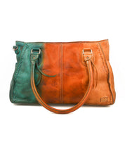 The Bed Stu Rockababy is a compact everyday bag: a leather handbag with teal on the left, tan on the right, two handles, visible edge stitching, and a crossbody strap for versatile carrying.