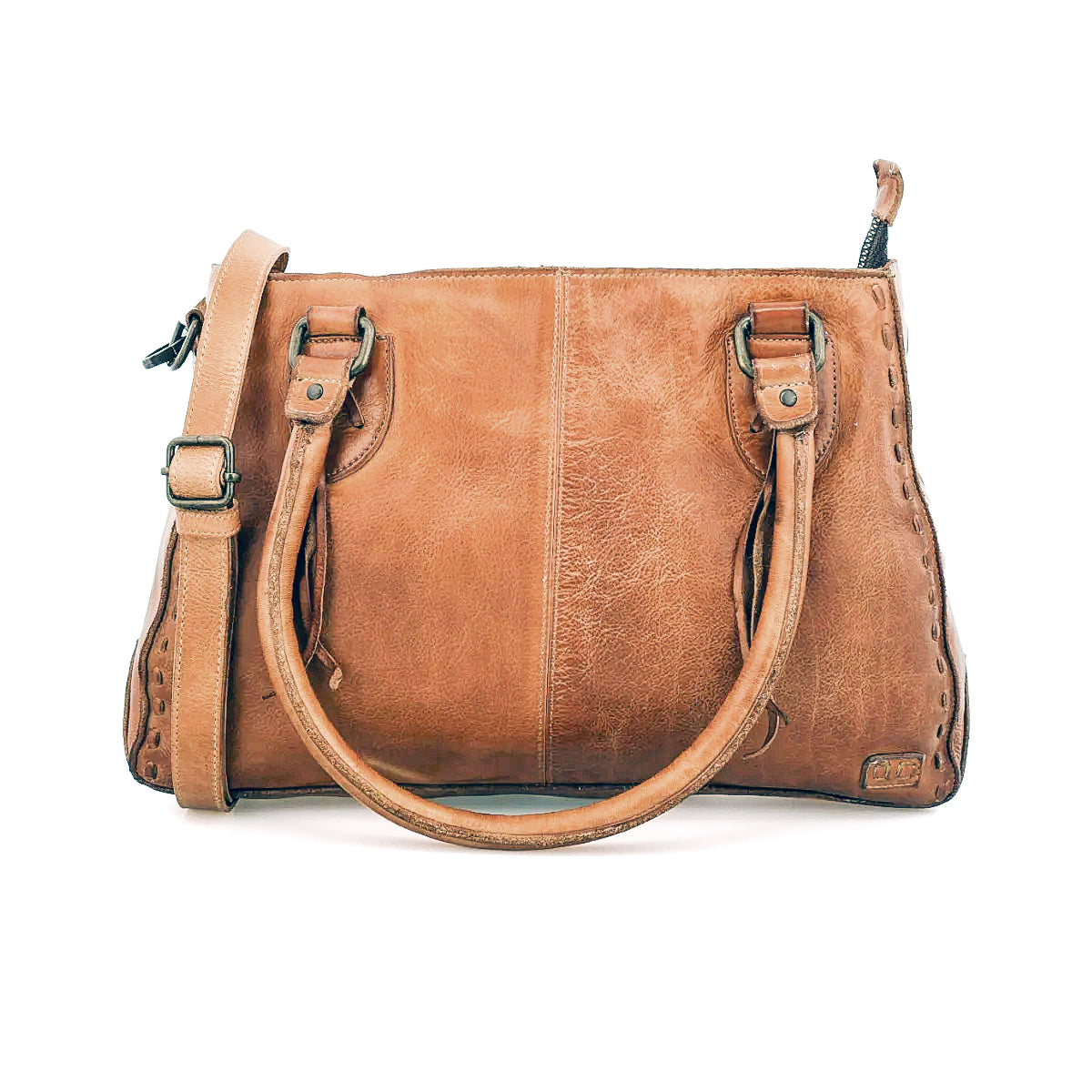 The Bed Stu Rockababy is a compact brown leather bag with two handles, a shoulder strap, visible stitching, and a slightly worn texture—perfect for everyday effortless style.