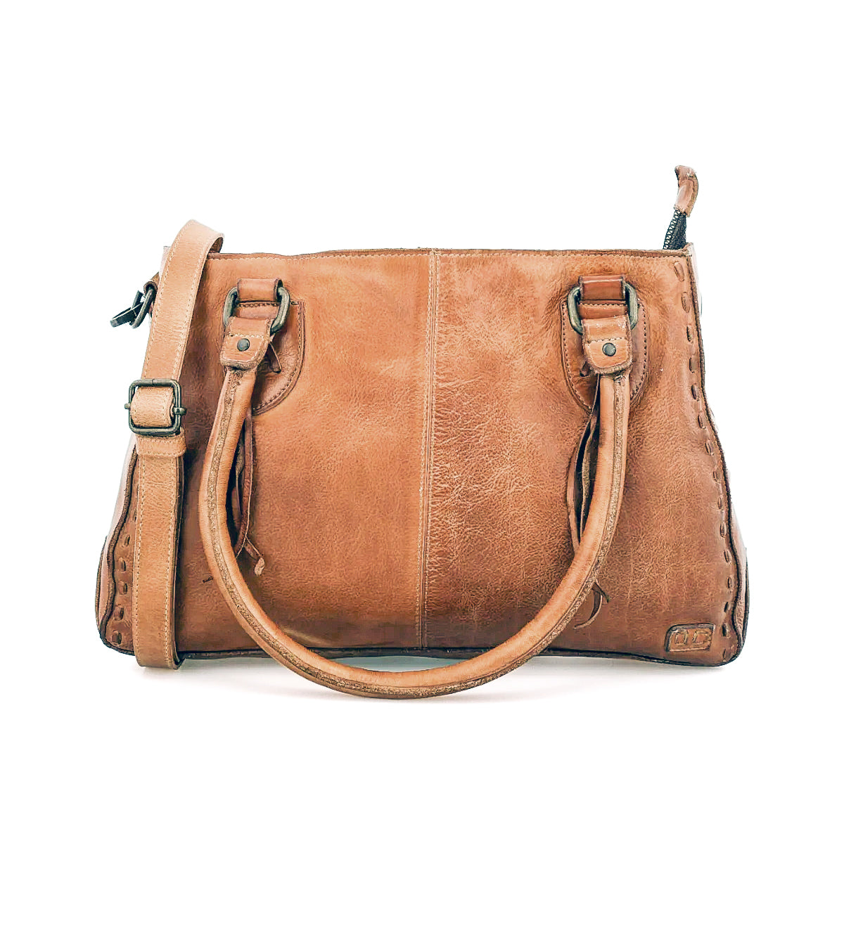 The Bed Stu Rockababy is a compact brown leather bag with two handles, a shoulder strap, visible stitching, and a slightly worn texture—perfect for everyday effortless style.