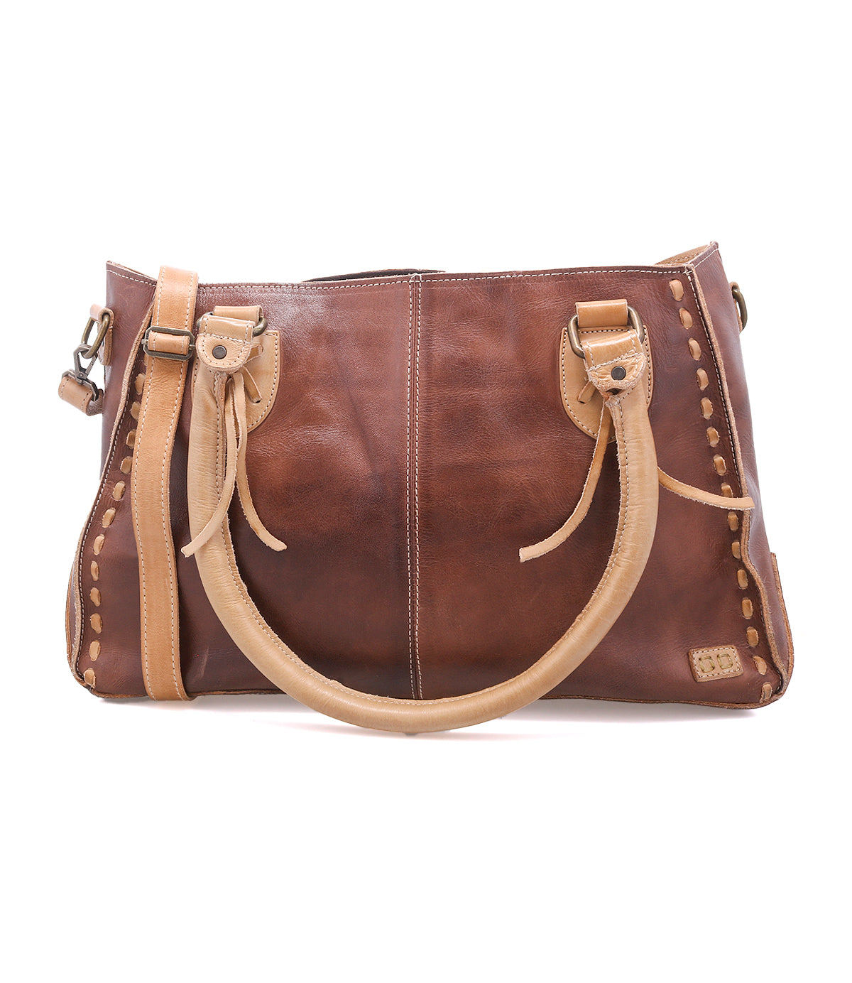 The Bed Stu Rockababy is a handcrafted brown full-grain leather handbag with tan handles, decorative stitching, a shoulder strap, and side details, shown on a white background.