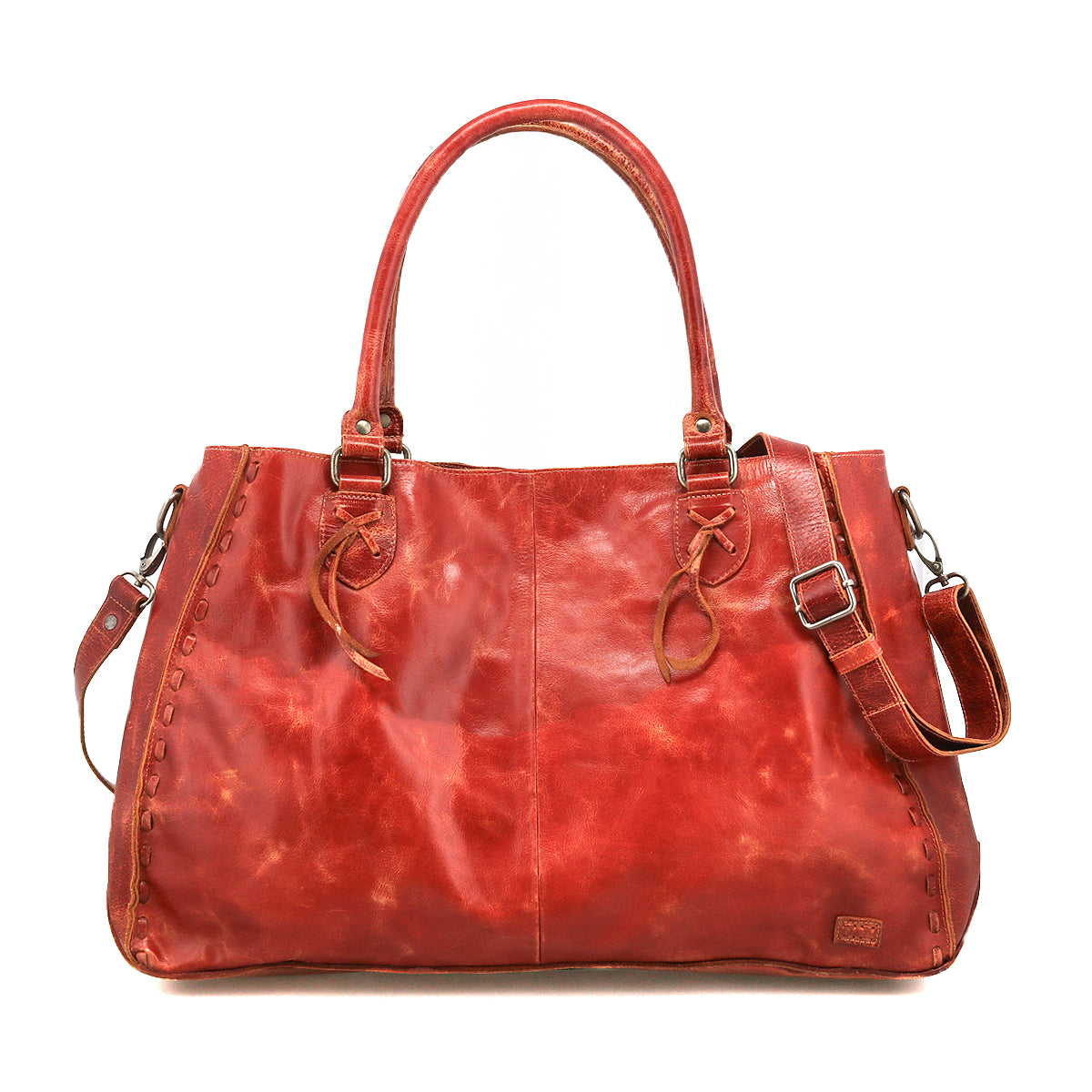 The Bed Stu Rockaway is a spacious, reddish-brown leather handbag featuring dual handles, side lacing, an adjustable shoulder strap, and a zip-pocket divider for organization.