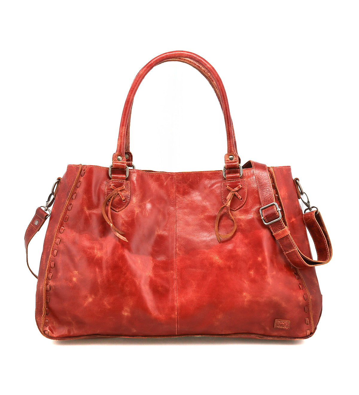 The Bed Stu Rockaway is a spacious, reddish-brown leather handbag featuring dual handles, side lacing, an adjustable shoulder strap, and a zip-pocket divider for organization.