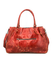 The Bed Stu Rockaway is a large, distressed red leather handbag with double handles, a front zip pocket, divider, detachable shoulder strap, and hidden phone pocket, all shown against a white background.