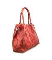The Bed Stu Rockaway is a large red leather handbag with double handles, side rings, visible stitching, and a zip-pocket divider. This best-seller is shown on a white background.