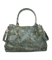 The Bed Stu Rockaway is a distressed teal leather handbag featuring two handles, a shoulder strap, side buckle strap, zip-pocket divider, and decorative stitching accents.