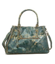 The Bed Stu Rockaway is a best-selling large teal leather handbag with a distressed finish, two handles, front zip pocket, and adjustable shoulder strap—blending style and everyday practicality.