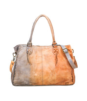 The Rockaway by Bed Stu is a large leather handbag with dual handles, a detachable shoulder strap, a gray-to-tan color gradient, and a zip-pocket divider for organization.