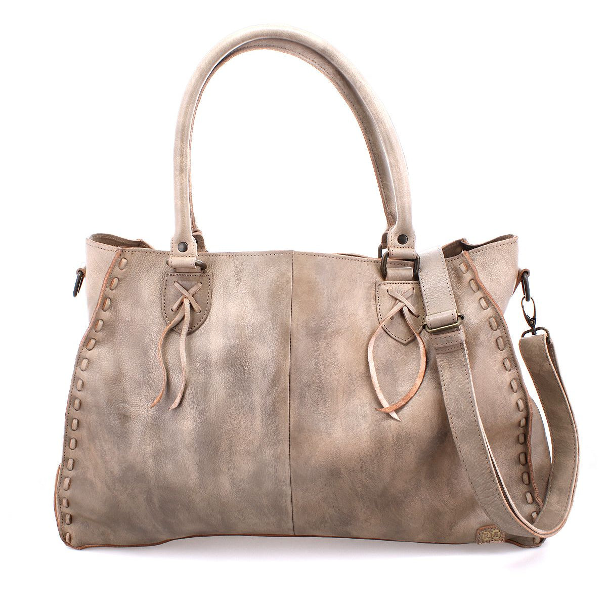 The Rockaway by Bed Stu is a spacious distressed leather bag with decorative stitching, dual handles, a zip-pocket divider, and a detachable shoulder strap.