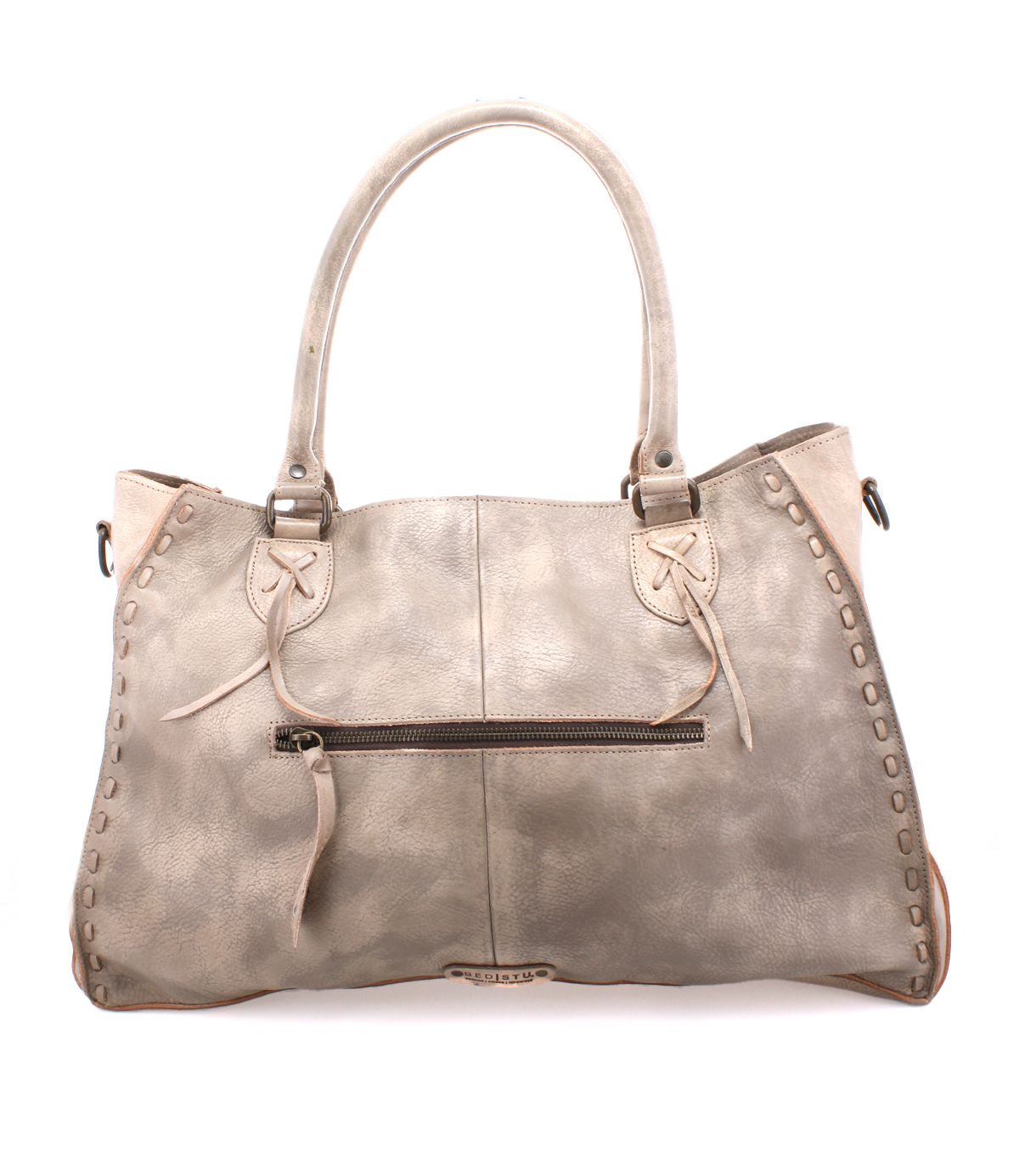 The Rockaway by Bed Stu is a spacious taupe leather handbag featuring double handles, a zip-pocket divider for organization, a front zipper pocket with tassel, and decorative stitching.