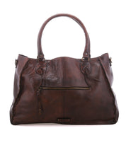 Rockaway by Bed|Stü: Large brown full-grain leather handbag with two handles, front zip pocket, and minimal stitching on a white background.