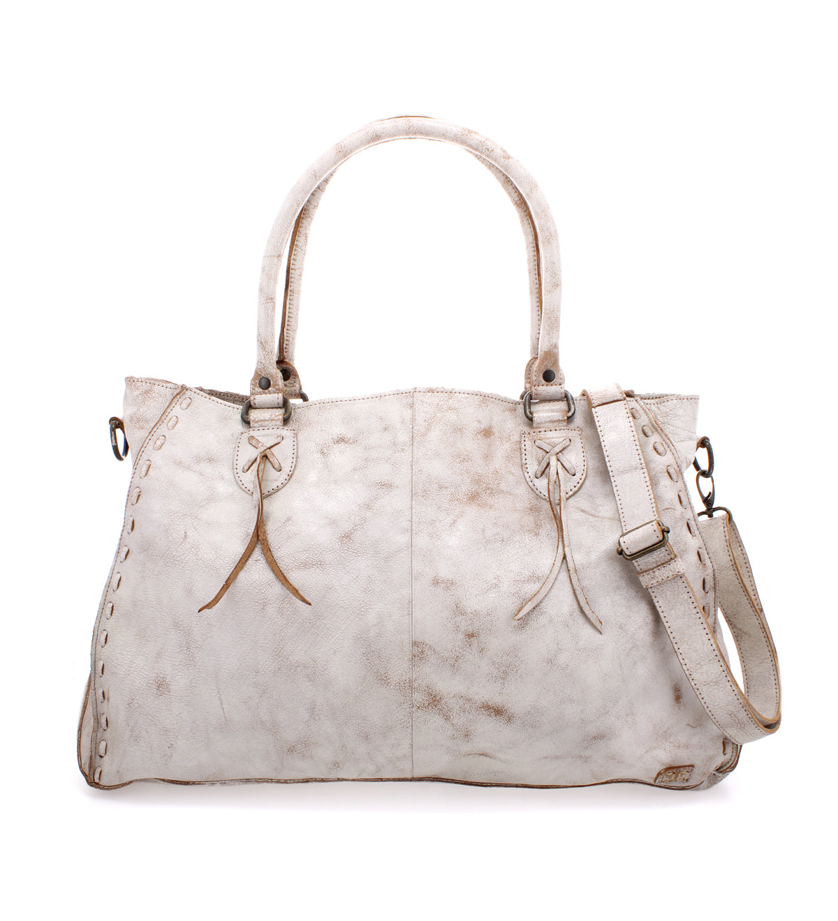 The Rockaway handbag by Bed Stu is crafted from white leather and showcases decorative stitching. It includes two handles, a zip-pocket divider, and an adjustable shoulder strap for added versatility.