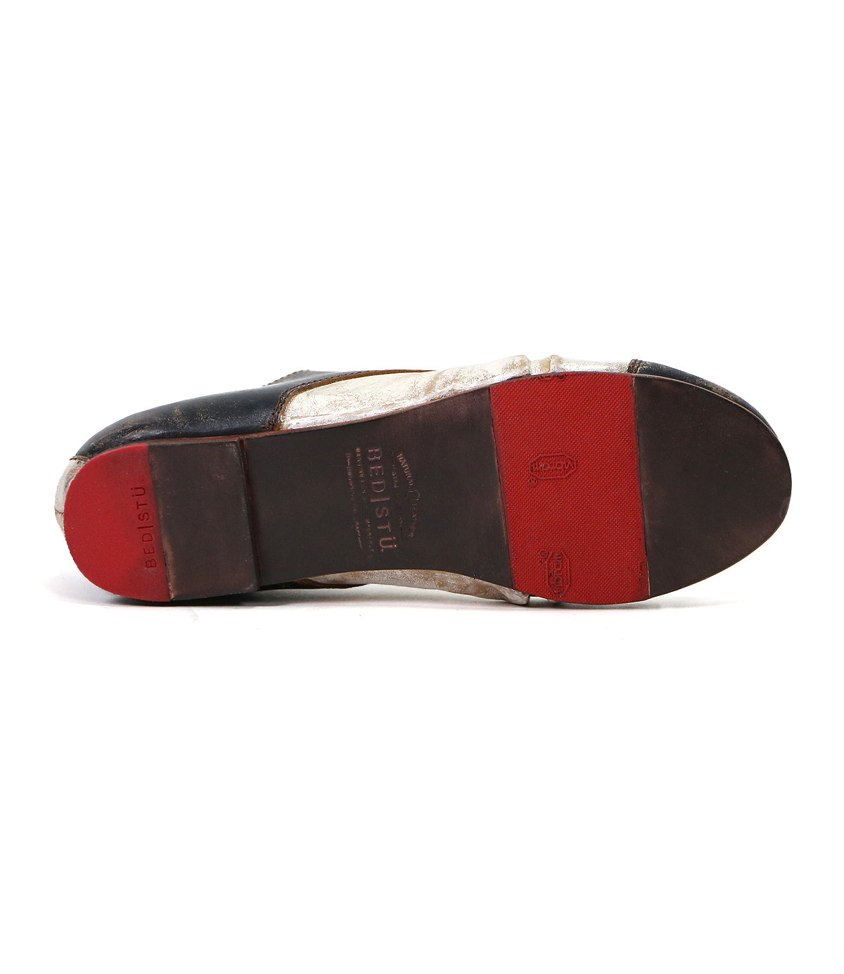 Bottom view of a used men's Bed Stu Rumba II soft leather shoe with a black and brown sole against a white background.