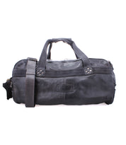 A black leather duffle with durable canvas straps, dual handles, a shoulder strap, and multiple compartments by Bed Stu called Ruslan.