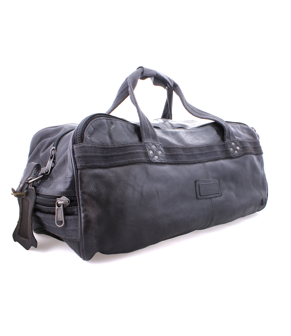 A black leather duffel bag with handles, durable canvas straps, and a zipper closure, featuring an organic cotton lining, Bed Stu's Ruslan.
