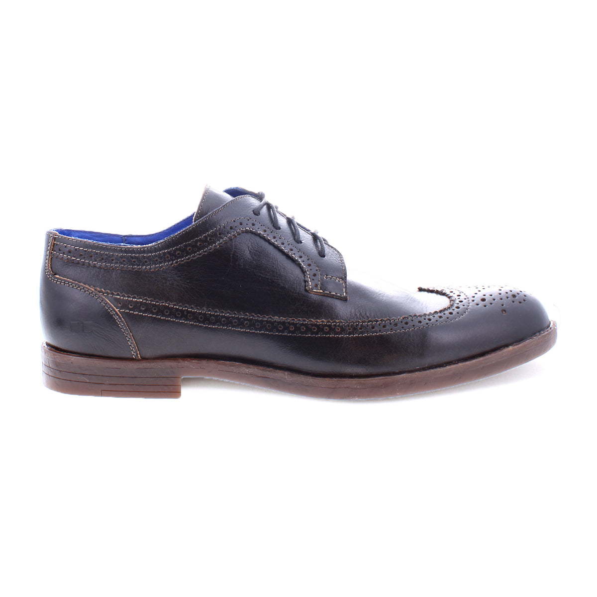 Sandro II, by Bed Stu, is a handcrafted leather men's office shoe showcasing a black leather wingtip toe with decorative brogue details, lace-up design, and brown sole from the side view.
