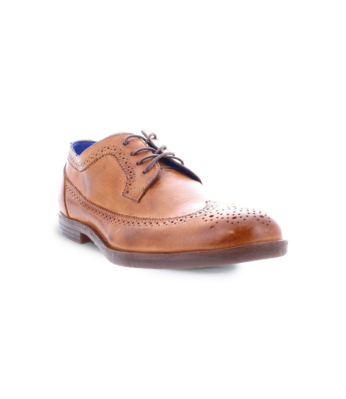 The Sandro II by Bed Stu is a brown leather brogue shoe featuring a wingtip toe design, decorative perforations, dark laces, and a low heel. It's an ideal men's office shoe for those who appreciate timeless style and elegance.