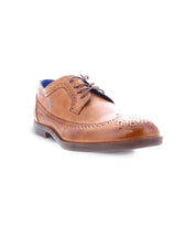 The Sandro II by Bed Stu is a brown leather brogue shoe featuring a wingtip toe design, decorative perforations, dark laces, and a low heel. It's an ideal men's office shoe for those who appreciate timeless style and elegance.