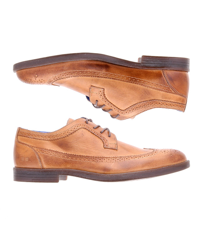The Sandro II by Bed Stu are two tan leather dress shoes with brogue details and handcrafted leather, featuring decorative perforations, laces, and dark soles, viewed from the side against a white background.