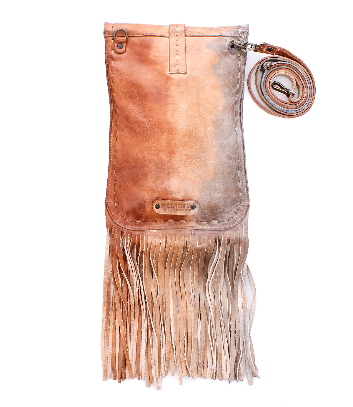 The Bed Stu Sandy Lane II is a tan fringe crossbody bag made from handmade vegetable-tanned leather, featuring a stitched flap, metal hardware, and adjustable strap, shown on a white background.