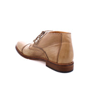 A tan leather Scoot boot by Bed Stu with a cap toe, laces, and a brown wooden sole, viewed from the back.